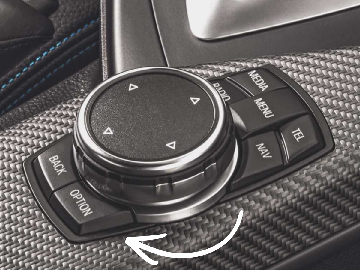 BMW iDrive controller with arrow showing the direction to turn back